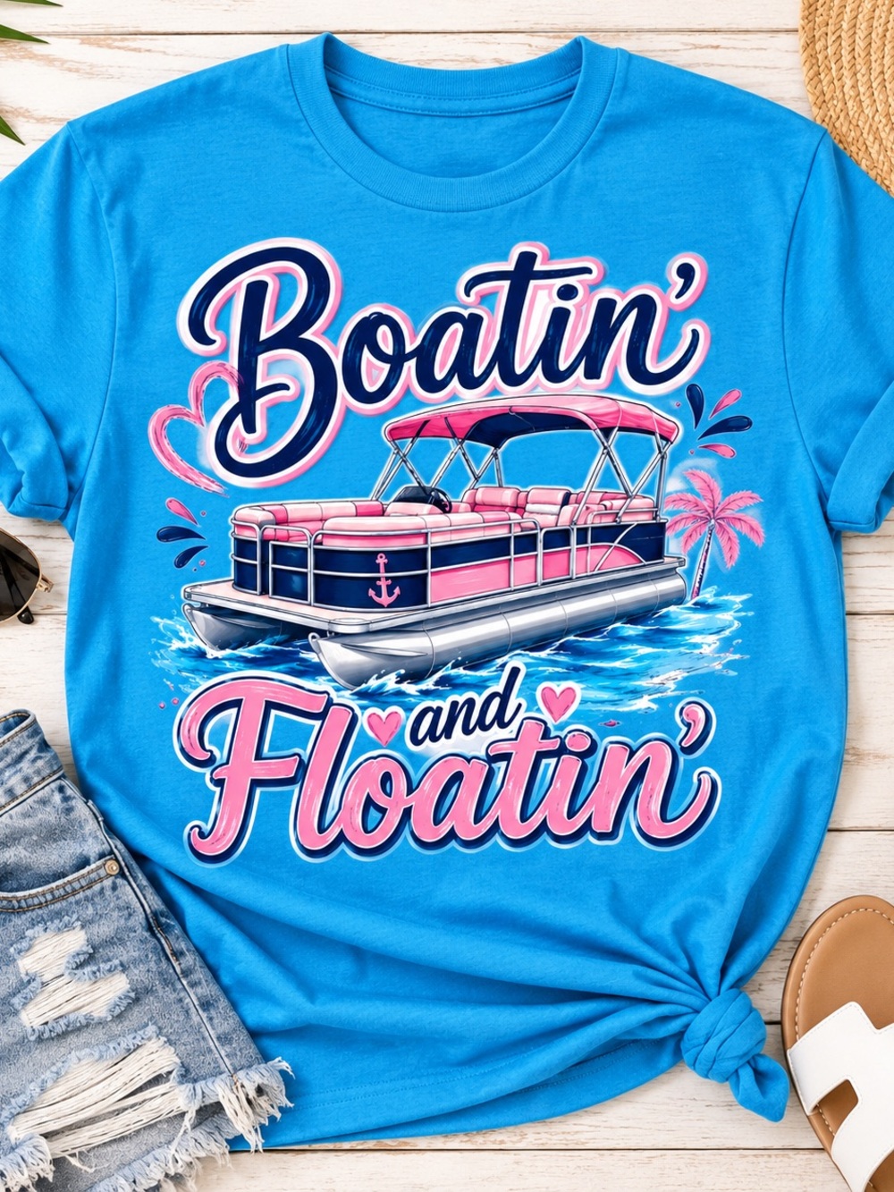 Comfort Colors Blue Woman’s Tee with Pink Pontoon Boat Graphic